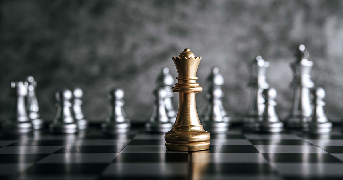 Gold and Silver Chess on chess board game for business metaphor